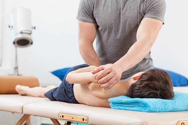 Close Up Of Physiotherapist Using Pnf Stretching Technique